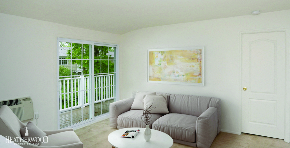 Living room and view of patio doors at Lakeside Village, East Patchogue